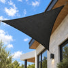 Anthracite triangular shade sail installed on an Australian home exterior facade with stainless steel chain fixings against a blue sky