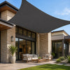 anthracite rectangular shade sail installed over an outdoor lounge area on an Australian modern home patio