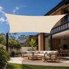 cream rectangular shade sail installed over an outdoor lounge area on an Australian modern home patio