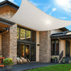 white rectangular shade sail installed over an outdoor lounge area on an Australian modern home patio