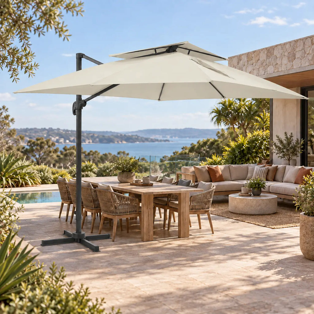 Cantilever umbrella 3x4 ivory over 10-seater teak outdoor dining set lounge sofa poolside coastal sea view terrace