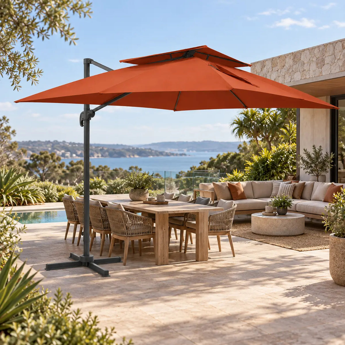 Cantilever umbrella 3x4 terracotta over 10-seater teak outdoor dining set lounge sofa poolside coastal sea view terrace