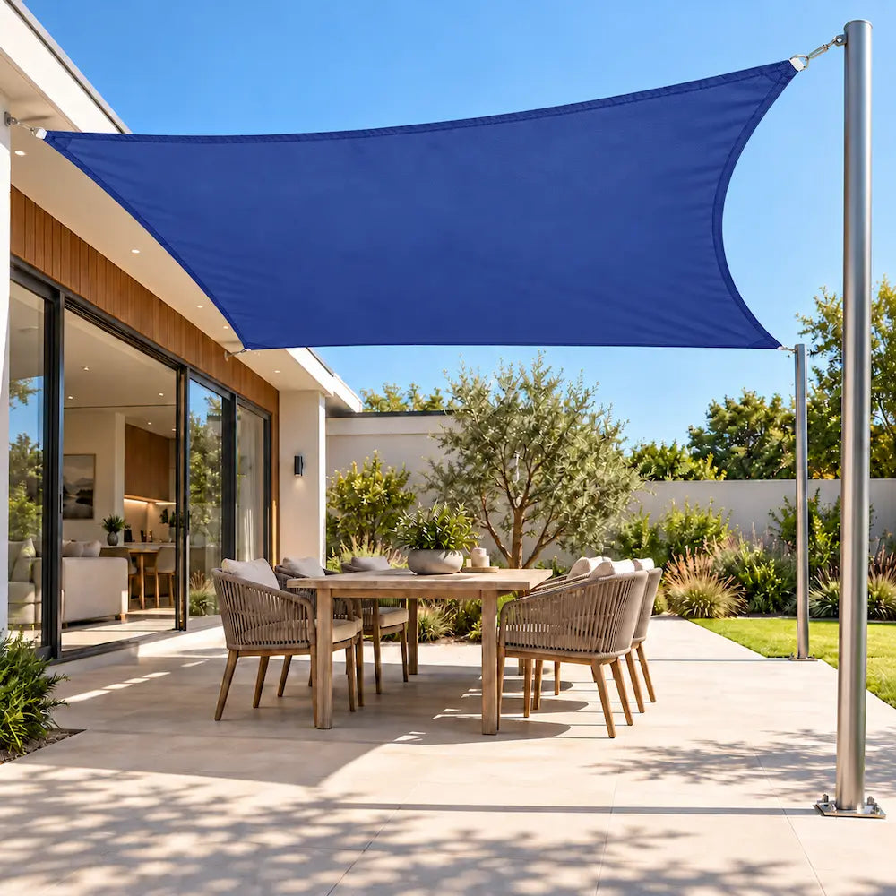 Shade sail in ocean blue, a waterproof rectangular sail over an outdoor dining table
