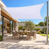 Shade sail in white, a bright rectangular canopy over a modern outdoor dining patio