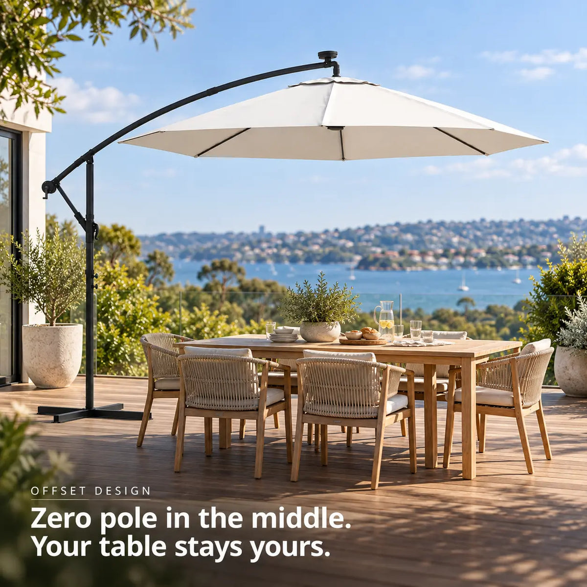 Round cantilever umbrella 3m sand solar LED offset design no centre pole 6-seater teak dining table wooden deck coastal sea view