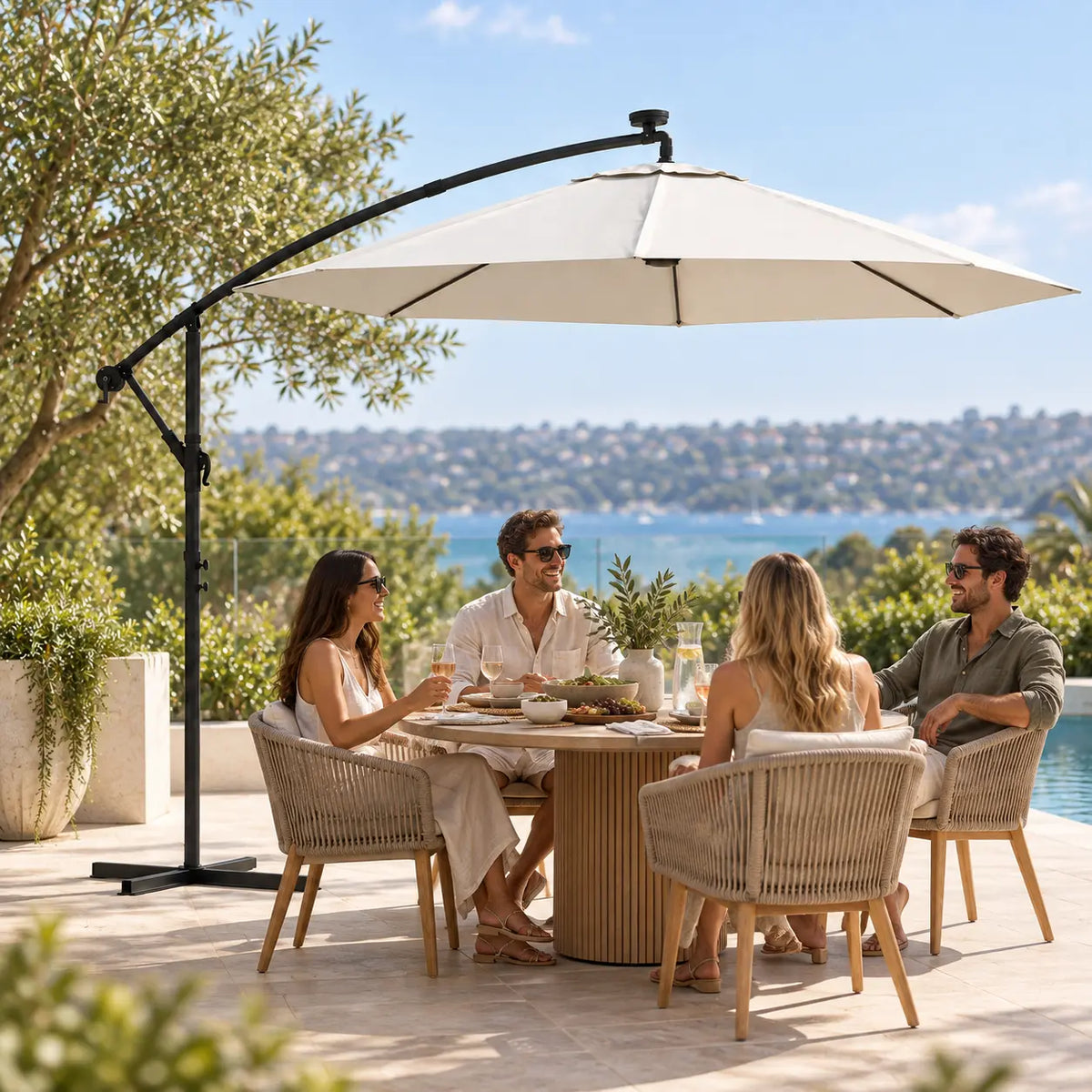 Round cantilever umbrella 3m sand friends outdoor dining round pedestal table poolside sea view daytime