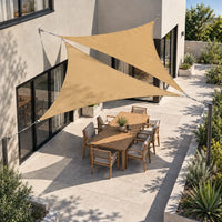 Shade sail pair in sand, two overlapping triangles above a courtyard dining area, seen from above
