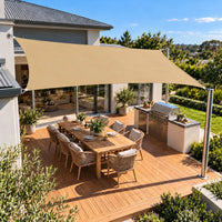 Shade sail sand rectangle shading an alfresco deck with built-in barbecue and dining table