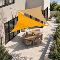 Shade sail sunflower yellow and sand triangles layered over a patio dining setting, seen from above
