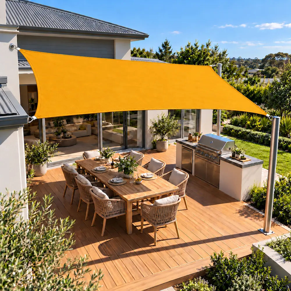 Shade sail sunflower yellow rectangle shading a timber entertaining deck and BBQ kitchen