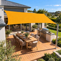 Shade sail sunflower yellow rectangle shading a timber entertaining deck and BBQ kitchen