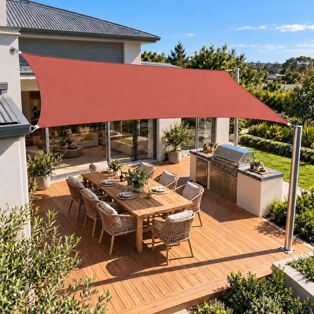 Shade sail terracotta rectangle with UV protection over an alfresco deck and outdoor kitchen