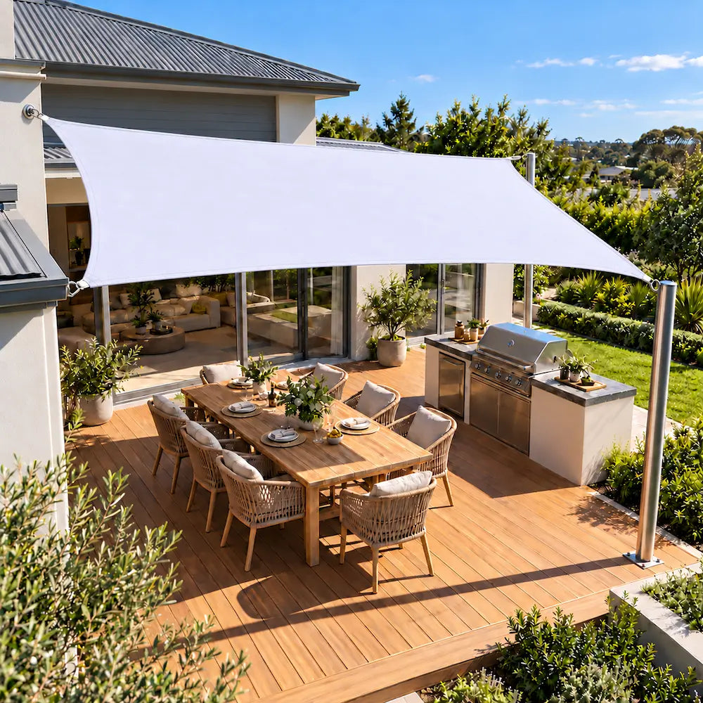 Shade sail white rectangle reflecting the heat above a timber deck and BBQ area