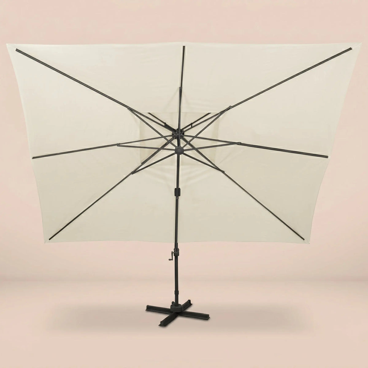 Rear view of the Sirocco XL 3x4m cantilever umbrella with eight-rib frame and vented double canopy in ivory