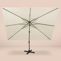 Rear view of the Sirocco XL 3x4m cantilever umbrella with eight-rib frame and vented double canopy in ivory