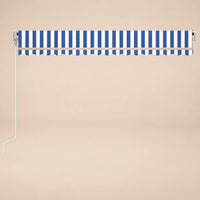 Blue and white striped retractable awning fully retracted, front view with scalloped valance