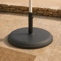 Round umbrella base installed on stone patio – 25kg anthracite weighted stand for patio umbrella, Australian outdoor setting