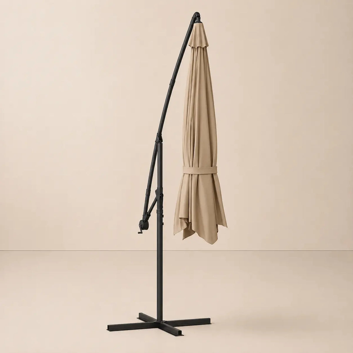 Round cantilever umbrella 3.5m Taupe folded and secured with carry strap on cross stand – Bora