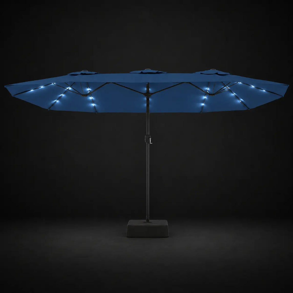 Azure blue double canopy market umbrella with integrated LED lights illuminated at night on a dark background