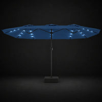 Azure blue double canopy market umbrella with integrated LED lights illuminated at night on a dark background