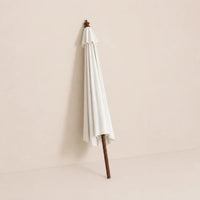 Domaine 3.5m large market umbrella folded closed with off-white canopy and turned hardwood finial for compact storage
