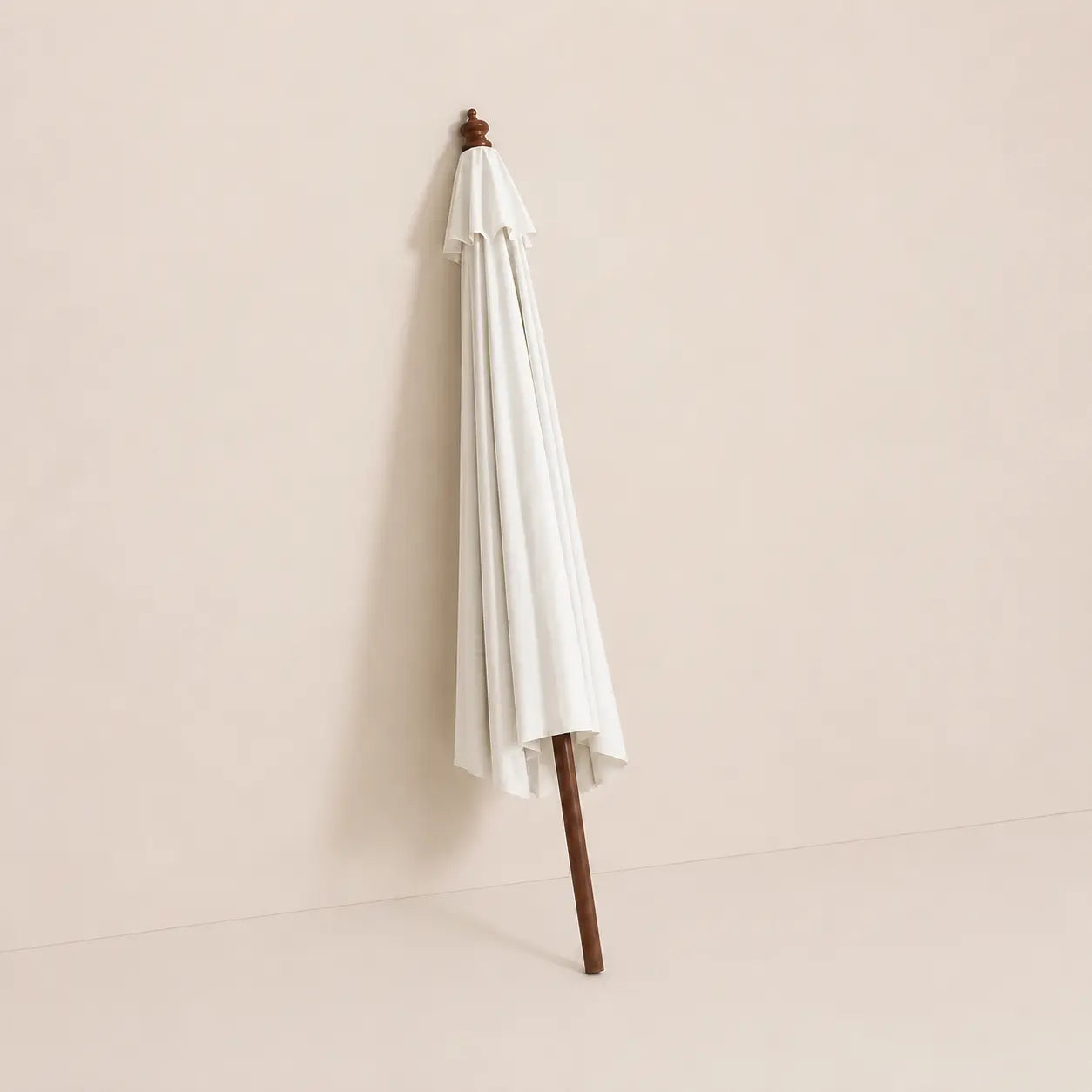 Domaine 3.5m large market umbrella folded closed with off-white canopy and turned hardwood finial for compact storage