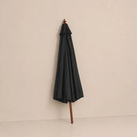 Anthracite market umbrella folded closed with hardwood pole and carved wooden finial