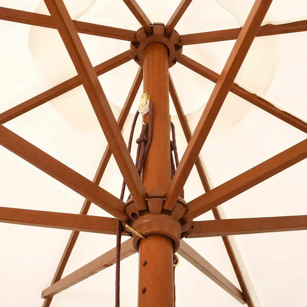 Underside view of a market umbrella showing hardwood rib frame, double pulley rope mechanism and brass fittings