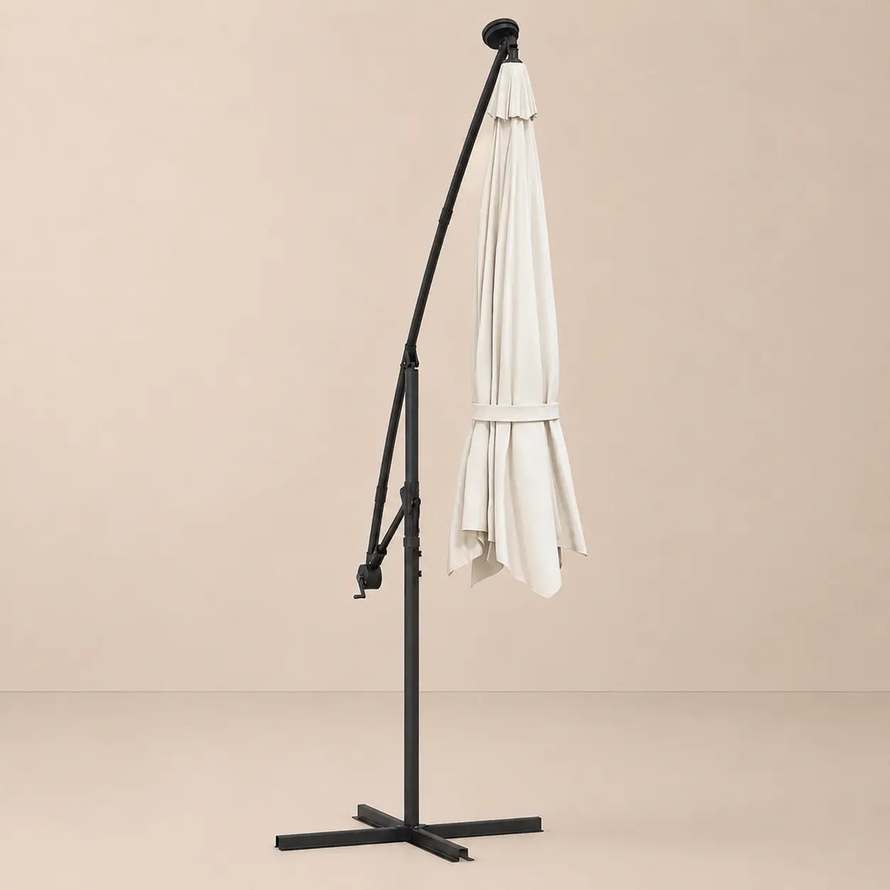 Round cantilever umbrella 3m Sand folded and secured with carry strap on cross stand with solar panel – Solano