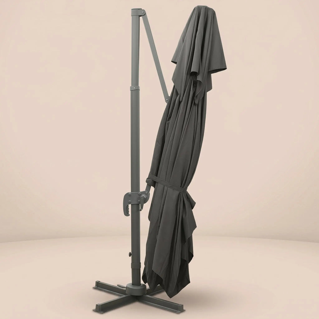 Levant XL rectangular cantilever umbrella folded and secured with fabric tie strap for compact storage