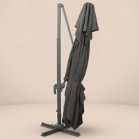 Levant XL rectangular cantilever umbrella folded and secured with fabric tie strap for compact storage