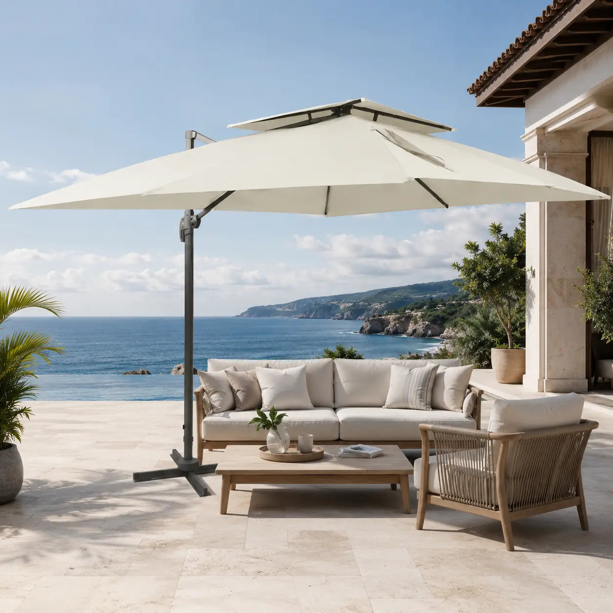 Rectangular ivory cantilever umbrella providing shade over a poolside sofa setting on a Mediterranean terrace