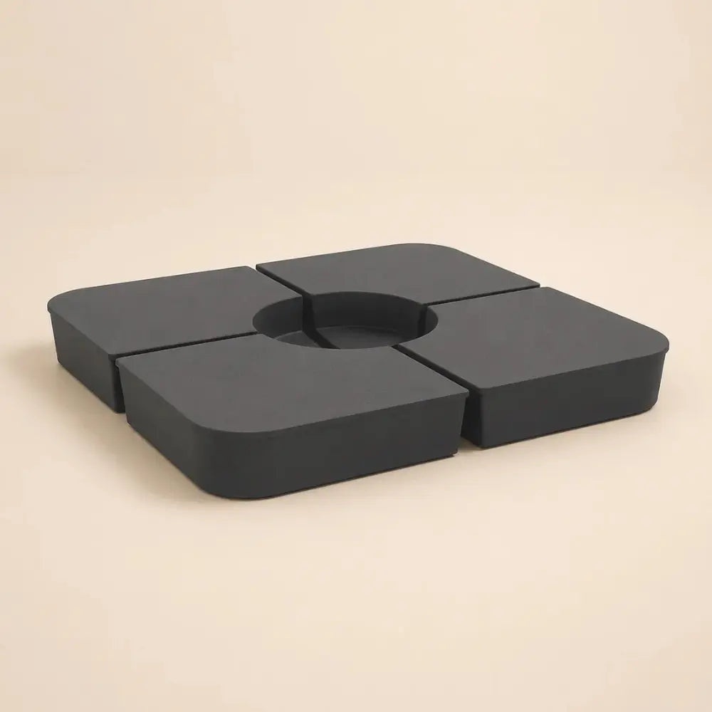 Cantilever umbrella base weight – 4-piece anthracite sand-fill plates assembled, top angled view, Holdfast 100kg stabiliser kit