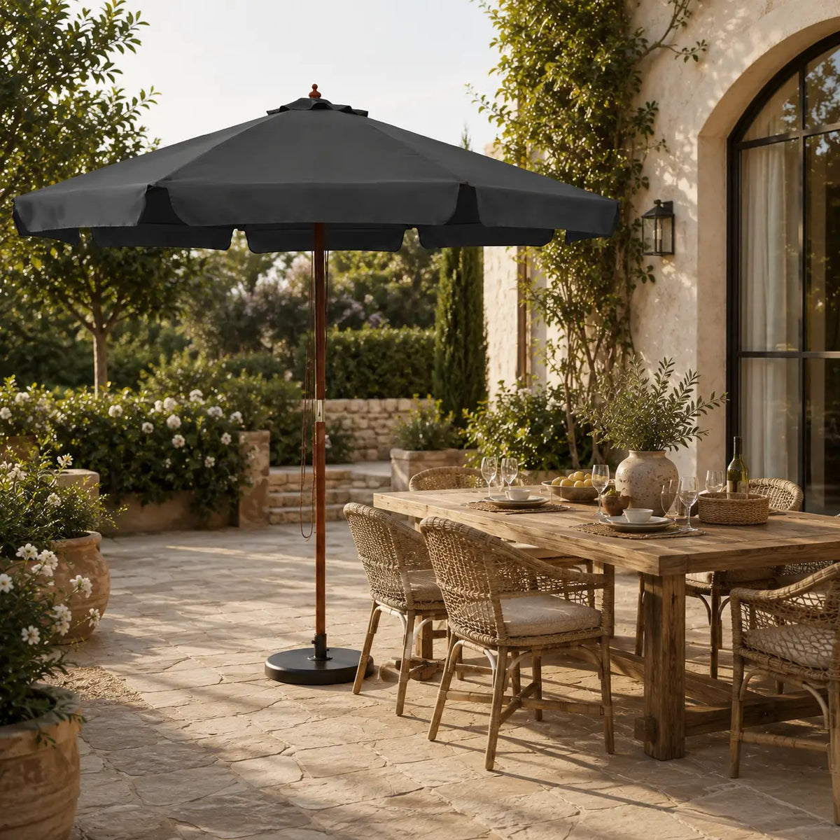 3.3m anthracite market umbrella beside a timber outdoor dining table in a garden alfresco setting
