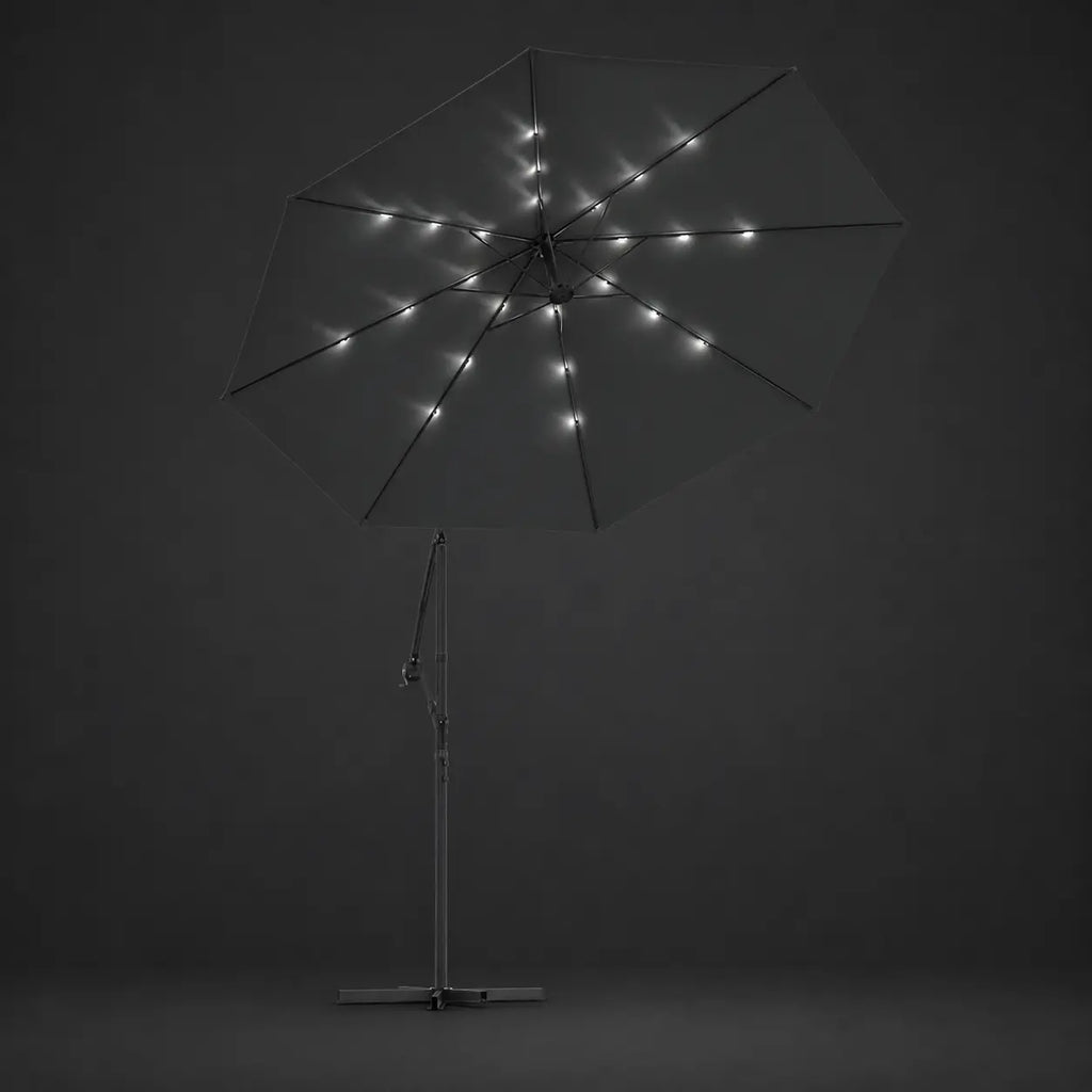 Round cantilever umbrella 3m Anthracite with solar LED lights illuminated along ribs at night – Libeccio