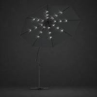 Round cantilever umbrella 3m Anthracite with solar LED lights illuminated along ribs at night – Libeccio