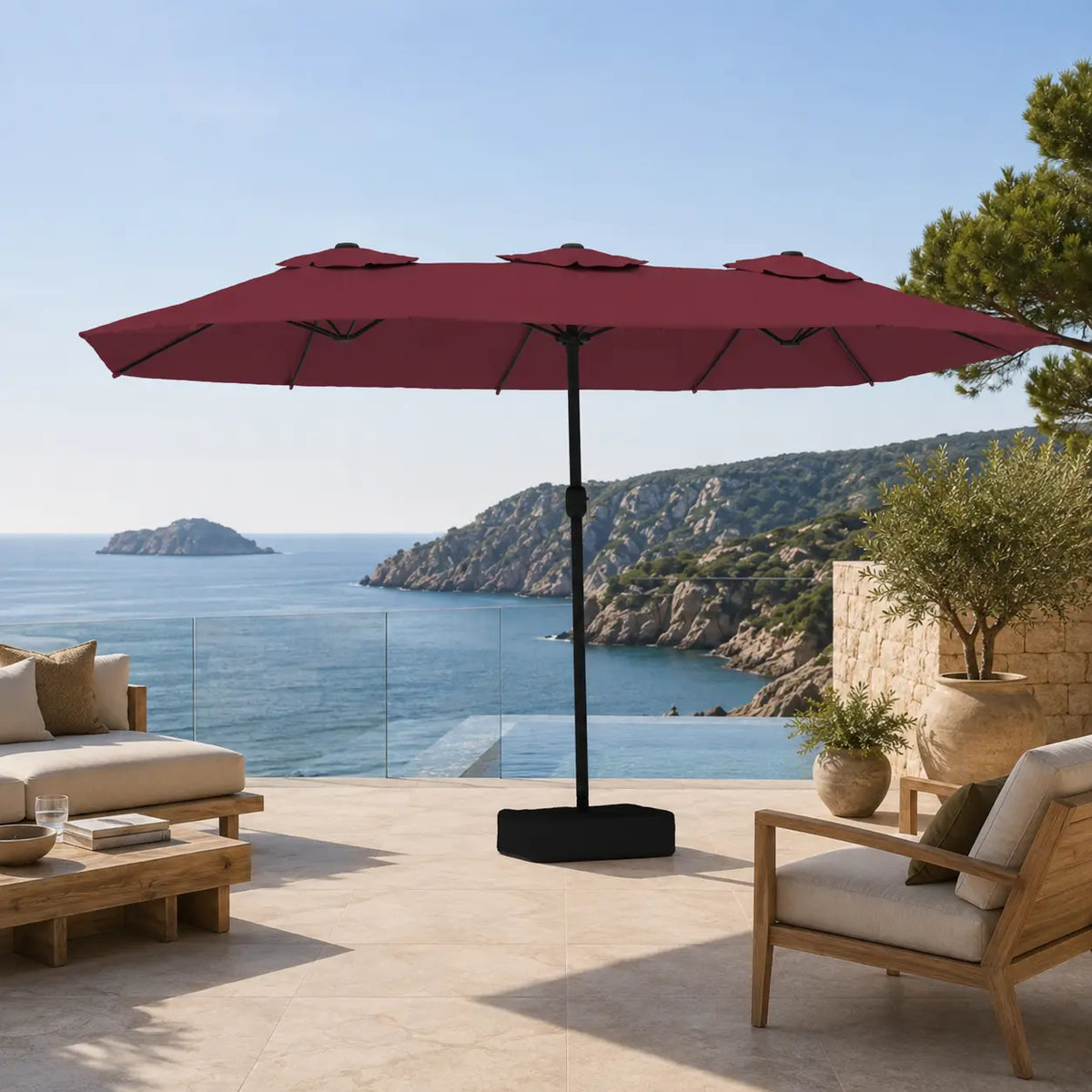 Large bordeaux double canopy market umbrella over timber outdoor lounge furniture on a coastal Australian terrace