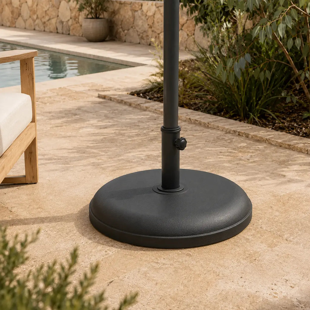 Round black umbrella base on poolside stone terrace – 25kg anthracite weighted stand, Australian outdoor entertaining area