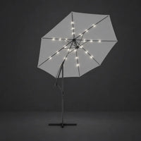 Round cantilever umbrella 3m Sand with solar LED lights illuminated along ribs at night – Solano