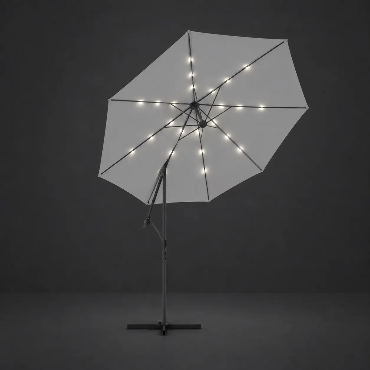 Round cantilever umbrella 3m Sand with solar LED lights illuminated along ribs at night – Solano
