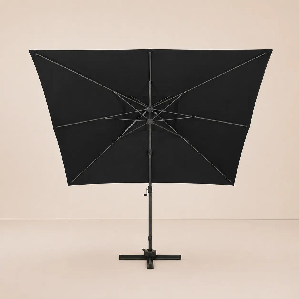 Rear view of the Mistral XL 3x4m black cantilever umbrella with eight-rib frame and vented double canopy