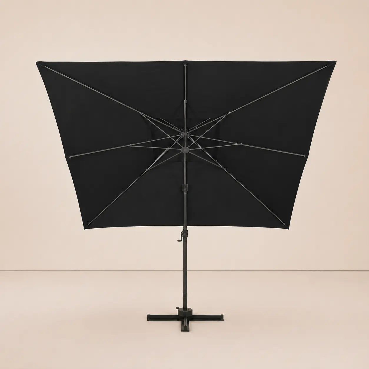 Rear view of the Mistral XL 3x4m black cantilever umbrella with eight-rib frame and vented double canopy