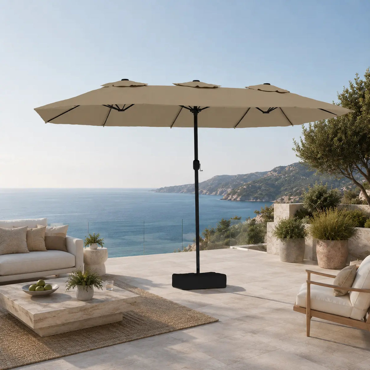 Large taupe double canopy market umbrella over timber outdoor lounge furniture on a coastal Australian terrace