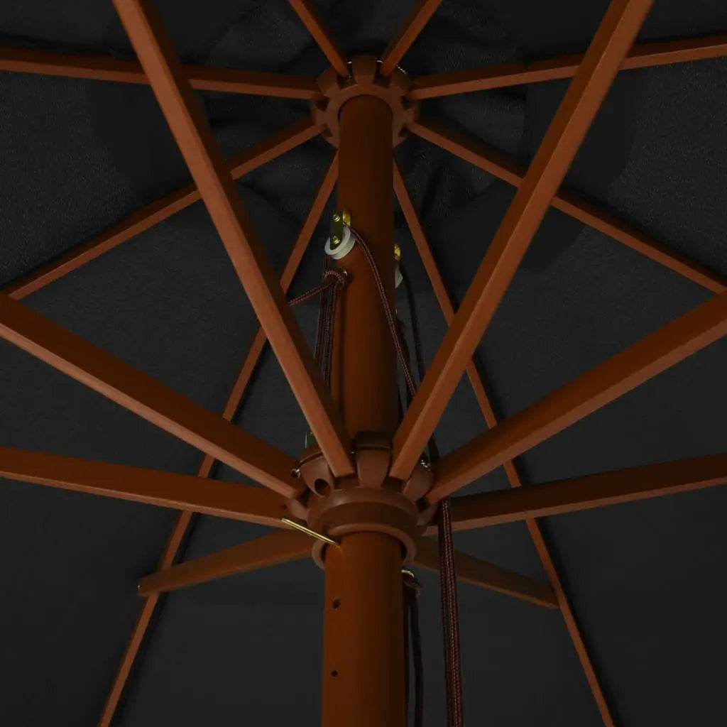 Underside view of an anthracite market umbrella showing hardwood rib frame, double pulley rope mechanism and brass fittings