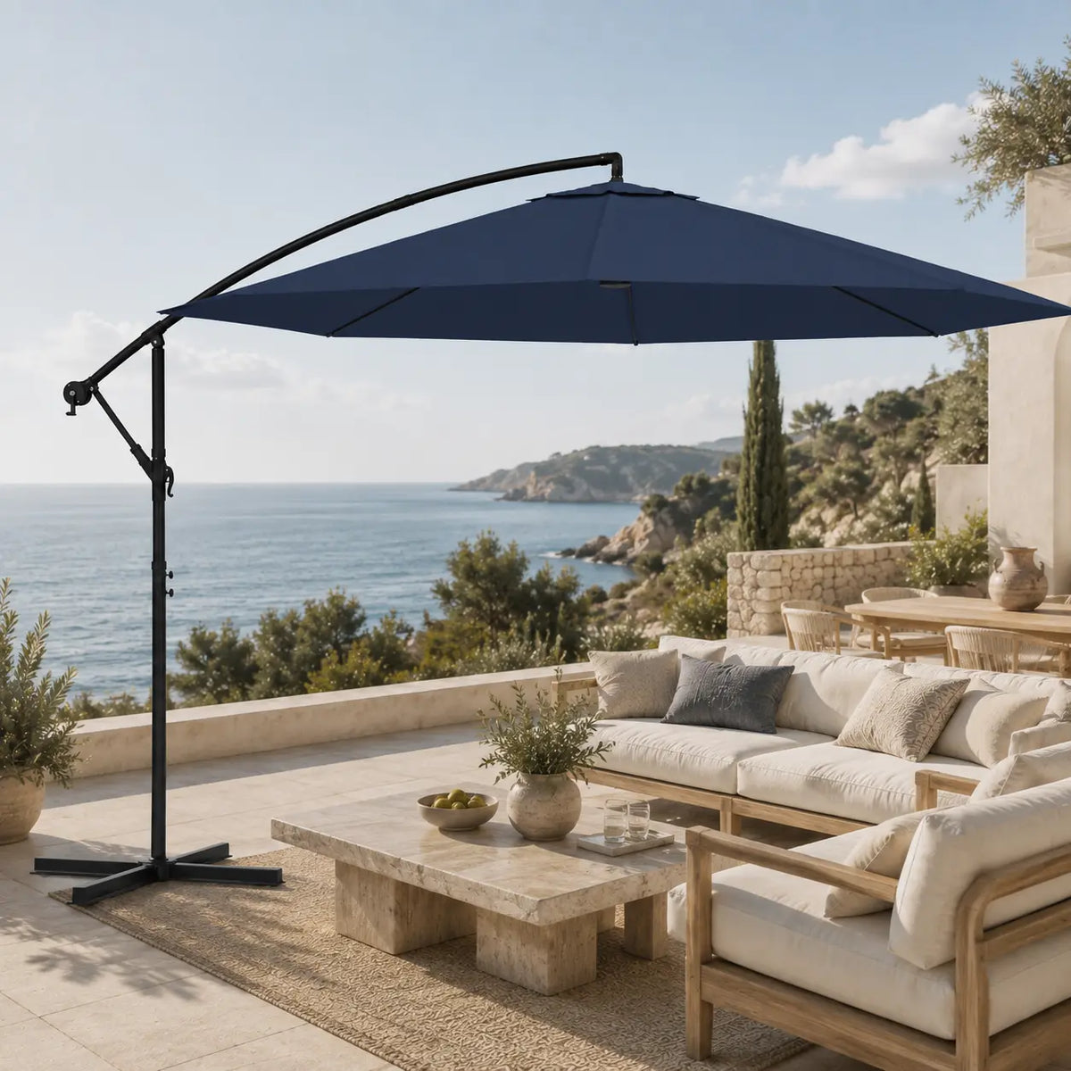 Round cantilever umbrella 3.5m Blue over outdoor sofa on open sea-view patio – Marin