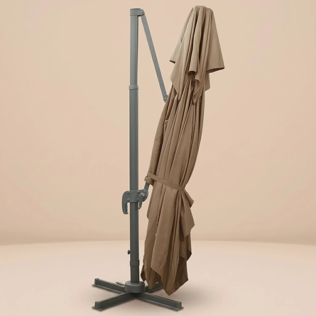 Tramontane XL rectangular cantilever umbrella folded and secured with fabric tie strap for compact storage