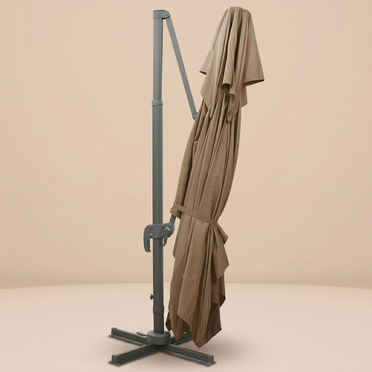 Tramontane XL rectangular cantilever umbrella folded and secured with fabric tie strap for compact storage