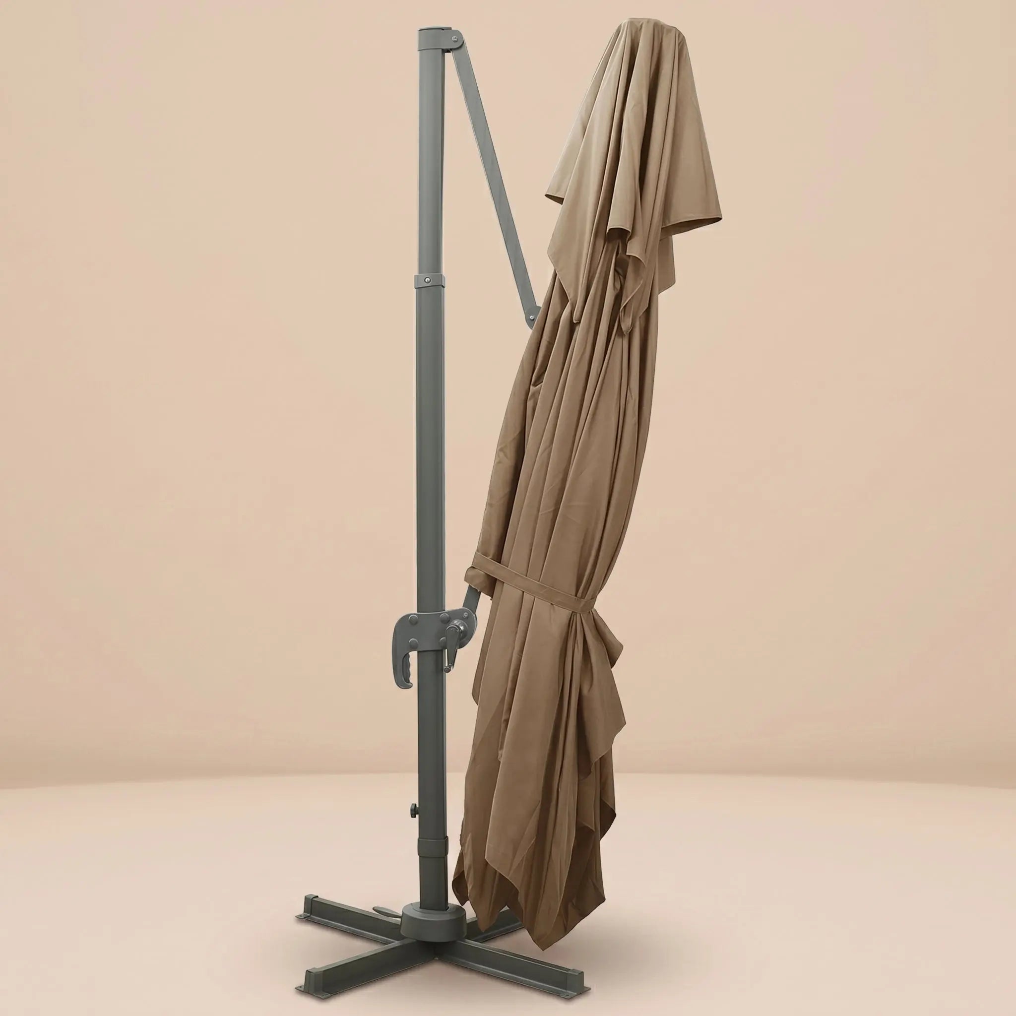 Tramontane XL rectangular cantilever umbrella folded and secured with fabric tie strap for compact storage