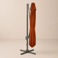 Terracotta cantilever umbrella fully closed with tie strap – compact folded position, dark grey aluminium frame, 3x4m outdoor umbrella