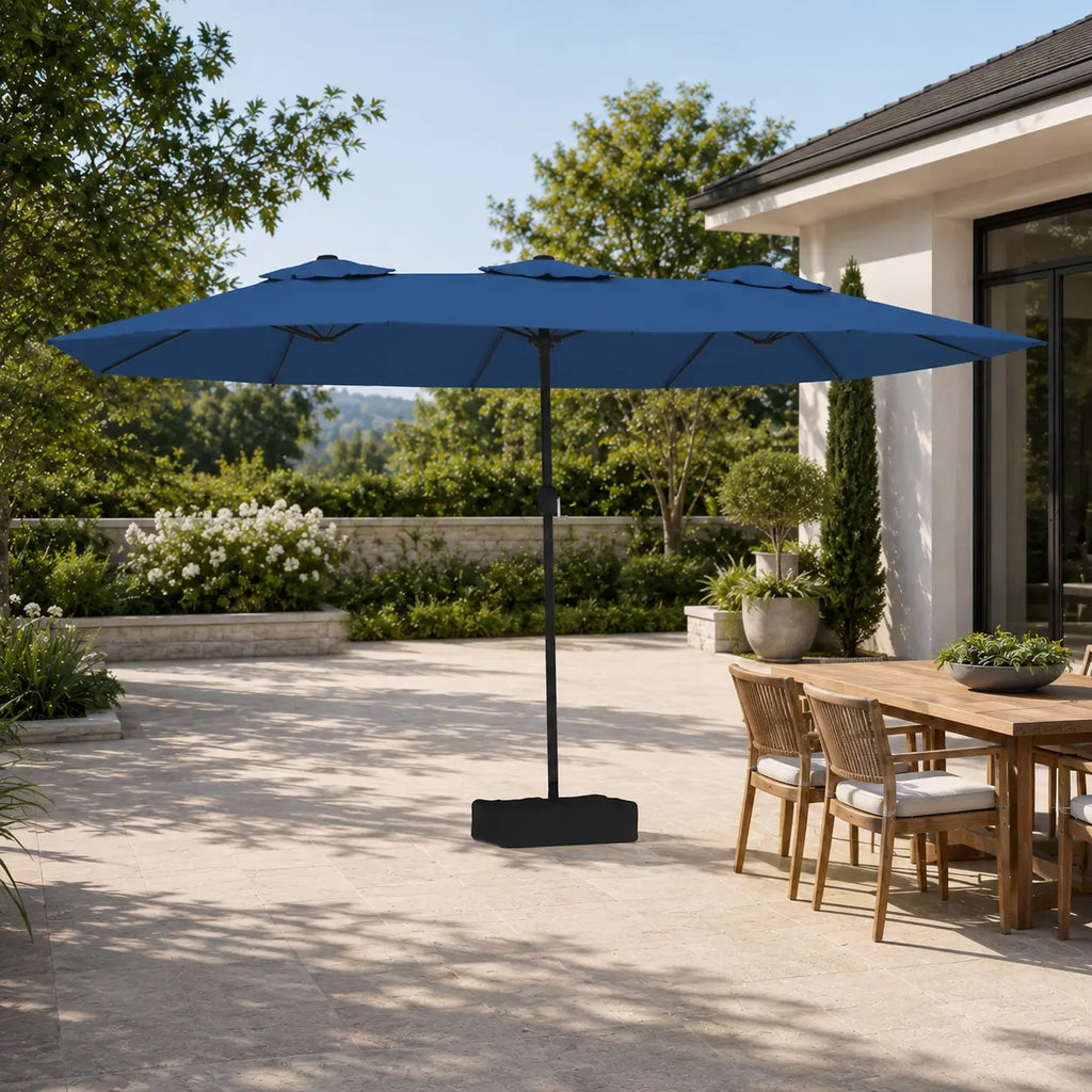 4.5m azure blue double canopy market umbrella shading a timber outdoor dining table in a garden alfresco setting